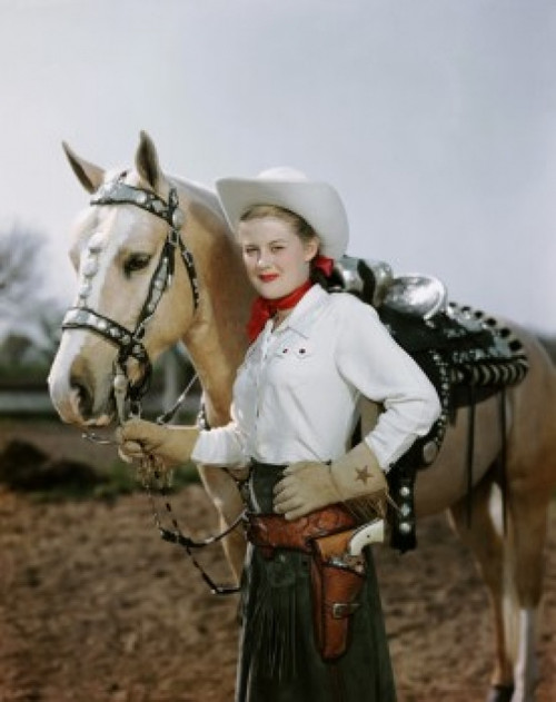 Portrait of a young woman holding the reins of a horse Poster Print - Item # VARSAL307736194