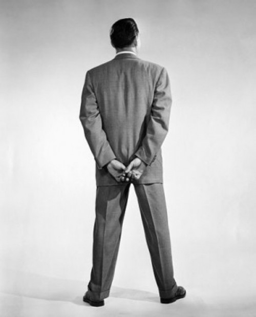 Rear view of a man standing with his hands behind his back Poster Print - Item # VARSAL25548103