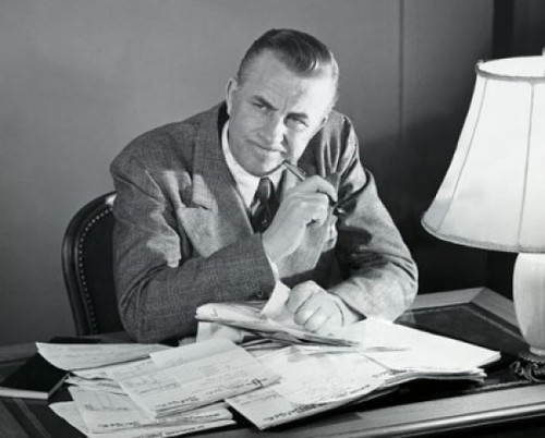 Businessman sitting at a desk in an office and thinking Poster Print - Item # VARSAL25548288B