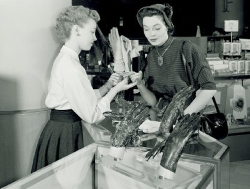 Woman watching gloves in shop Poster Print - Item # VARSAL255418645