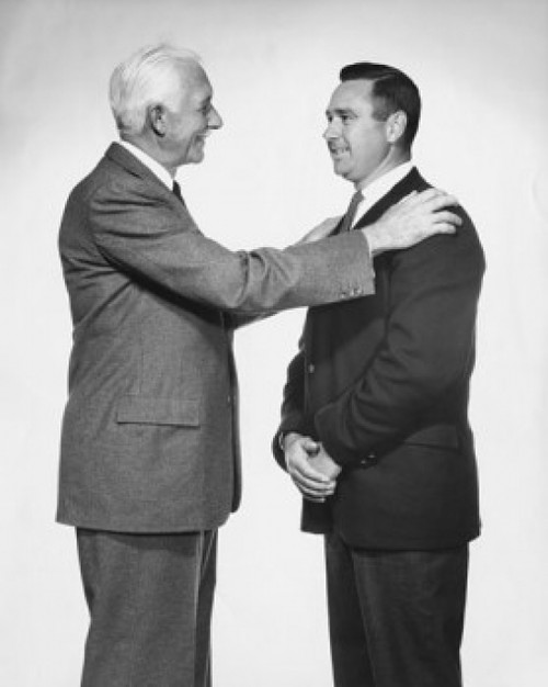 Two businessmen satanding face to face Poster Print - Item # VARSAL25548055