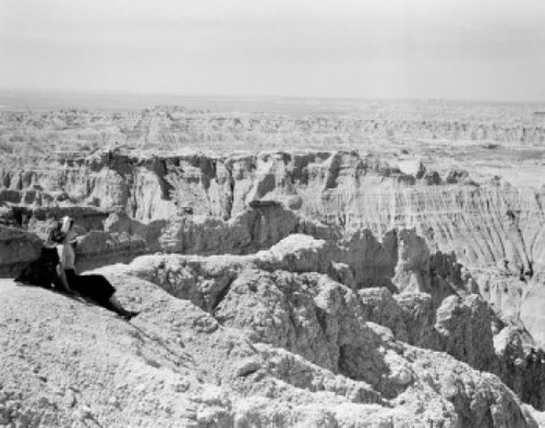 USA  South Dakota  South Dakota Badlands  Female tourist watching lover landscape Poster Print - Item # VARSAL255416304