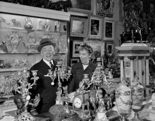 Mature man and mature woman watching decors in store Poster Print - Item # VARSAL255416703