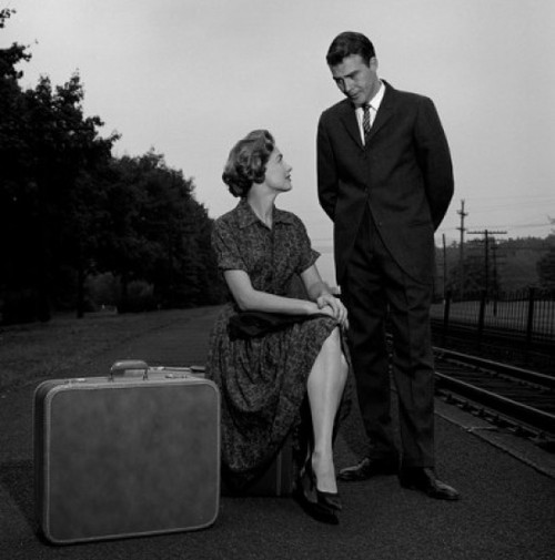 Young couple waiting at train station Poster Print - Item # VARSAL255416576B