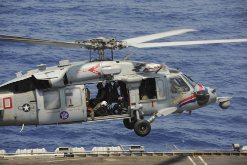 Red Sea, September 7, 2013 - An MH-60S Sea Hawk helicopter prepares to land on the flight deck of the aircraft carrier USS Nimitz Poster Print - Item # VARPSTSTK107818M