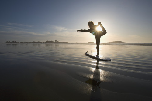Silhouette Of Female Surfer Doing Bow Pulling Yoga Pose; Chesterman Beach Tofino Vancouver Island British Columbia Canada PosterPrint - Item # VARDPI1938903