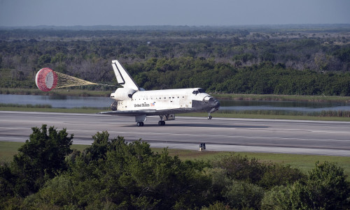 With drag chute unfurled space shuttle Discovery land on Runway 33 Shuttle Landing Facility Kennedy Space Center Florida - Item # VARPSTSTK203308S