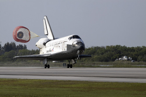 With drag chute unfurled space shuttle Discovery land on Runway 33 Shuttle Landing Facility Kennedy Space Center Florida - Item # VARPSTSTK203309S