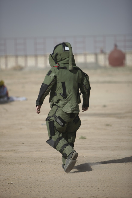 Kunduz, Afghanistan - A U.S. Marine tries running in a German Army EOD blast suit Poster Print - Item # VARPSTTMO100379M Kunduz, Afghanistan - A U.S. Marine tries running in a German Army EOD blast suit Poster Print - Item # VARPSTTMO100379M
