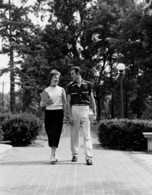 Young couple walking and talking Poster Print - Item # VARSAL255419333