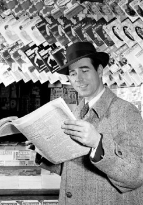 Man reading newspaper in kiosk Poster Print - Item # VARSAL255417014