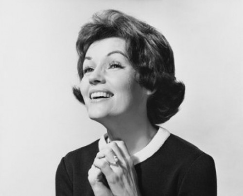 Mature woman with hands clasped and smiling Poster Print - Item # VARSAL25511304