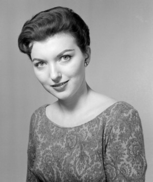 Studio portrait of young woman smiling Poster Print - Item # VARSAL255417635