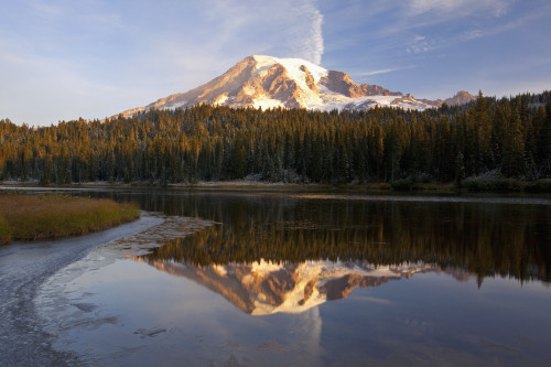 Washington, United States Of America; Reflection Of Mount Rainier In A Lake With Ice On The Surface In Mt. Rainier National Park PosterPrint - Item # VARDPI1876541