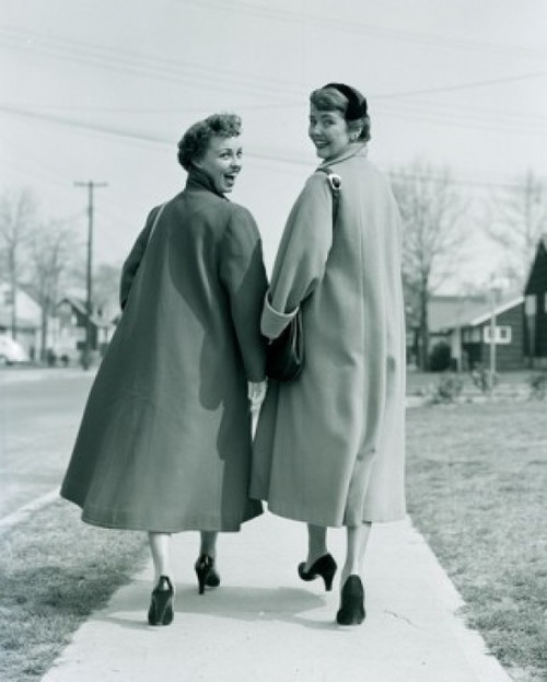 Portrait of two young women walking on pavement Poster Print - Item # VARSAL255417305