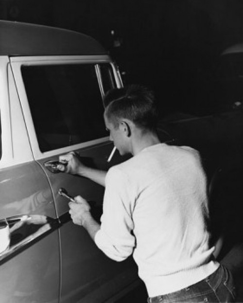 Rear view of a thief stealing a car Poster Print - Item # VARSAL25528246