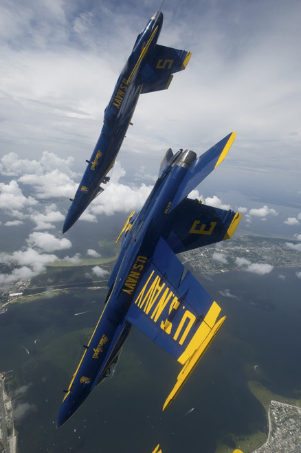 Pensacola, Florida, July 12, 2012 - The U.S. Navy flight demonstration squadron, the Blue Angels, perform a looping maneuver during a practice flight demonstration over Pensacola Beach, Florida Poster Print - Item # VARPSTSTK106291M