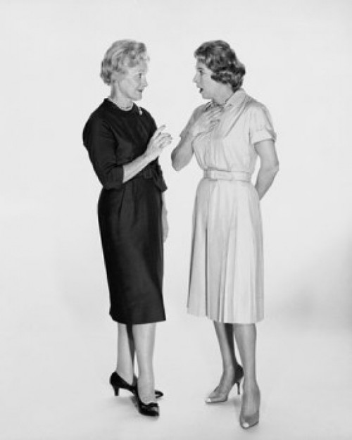 Two mid adult women talking to each other Poster Print - Item # VARSAL25549093