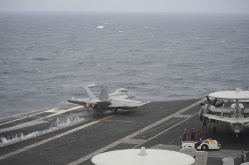 South China Sea, November 23, 2013 - An F/A-18F Super Hornet launches off the flight deck of the aircraft carrier USS Nimitz. Poster Print - Item # VARPSTSTK108127M