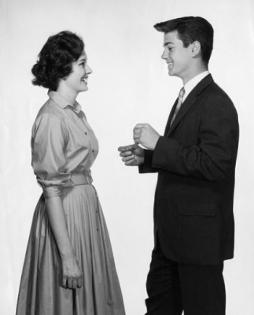 Side profile of a teenage couple standing face to face and smiling Poster Print - Item # VARSAL25541392 Side profile of a teenage couple standing face to face and smiling Poster Print - Item # VARSAL25541392