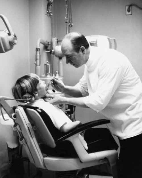 Side profile of a boy getting treatment from a dentist Poster Print - Item # VARSAL25525141