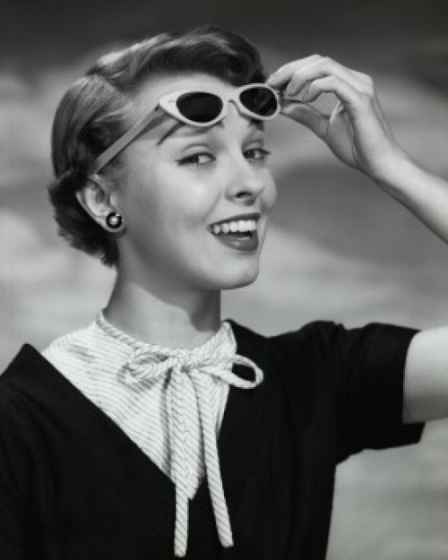 Close-up of young woman holding sunglasses Poster Print - Item # VARSAL2552910 Close-up of young woman holding sunglasses Poster Print - Item # VARSAL2552910