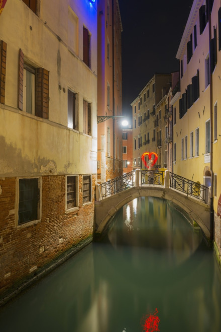A tranquil canal between buildings with a heart shape on a footbridge; Venice, Veneto, Italy PosterPrint - Item # VARDPI2413898