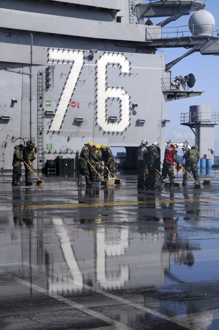 Sailors scrub the flight deck aboard the aircraft carrier USS Ronald Reagan Poster Print - Item # VARPSTSTK104245M