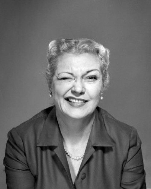 Studio portrait of woman winking Poster Print - Item # VARSAL25511598