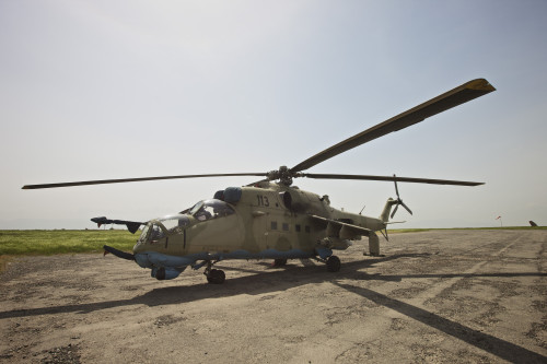 An Mi-35 attack helicopter operated by the Afghan National Army Air Corp at Kunduz Airfield, Northern Afghanistan Poster Print - Item # VARPSTTMO100476M