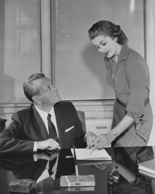 Businessman talking with his secretary in an office Poster Print - Item # VARSAL25548504