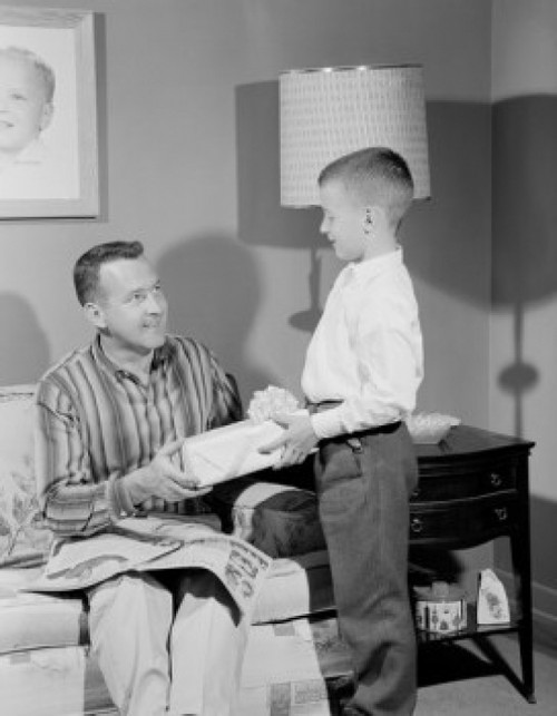 Boy giving gift to father Poster Print - Item # VARSAL255421921