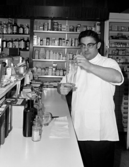 Man preparing medicines in pharmacy Poster Print - Item # VARSAL255416282