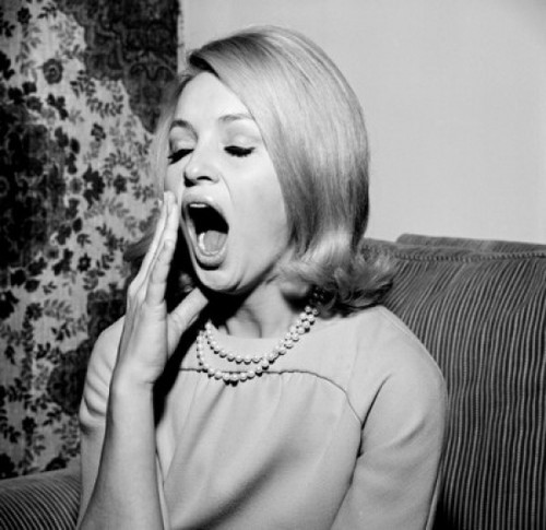 Young woman yawning Poster Print