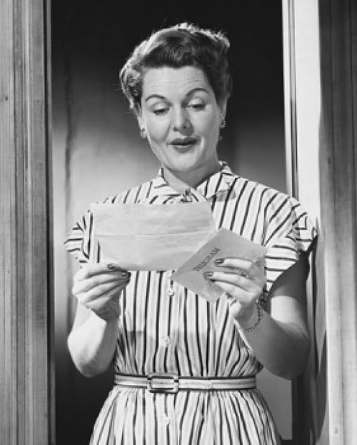 Mature woman reading a letter and smiling Poster Print - Item # VARSAL25549185 Mature woman reading a letter and smiling Poster Print - Item # VARSAL25549185