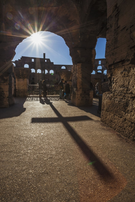 Sunburst through an archway at the Colosseum and a shadow of a cross; Rome, Italy PosterPrint - Item # VARDPI12287073