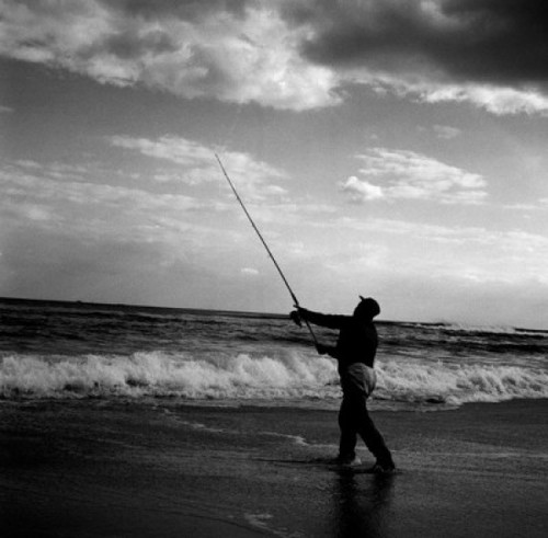 Man fishing at the edge of water Poster Print - Item # VARSAL255417828