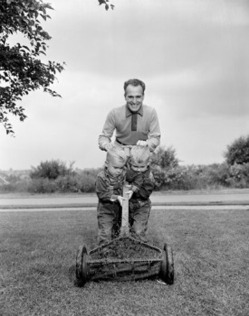 Father with two sons mowing lawn Poster Print - Item # VARSAL255424539