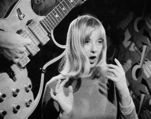 Young woman singing with electric guitarist playing guitar in foreground Poster Print - Item # VARSAL25518434