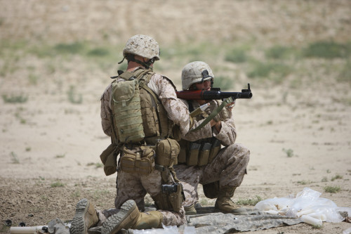 U.S. Marines prepare a high-explosive fragmentation round for the RPG-7 rocket-propelled grenade launcher in a wadi near Kunduz, Afghanistan Poster Print - Item # VARPSTTMO100315M