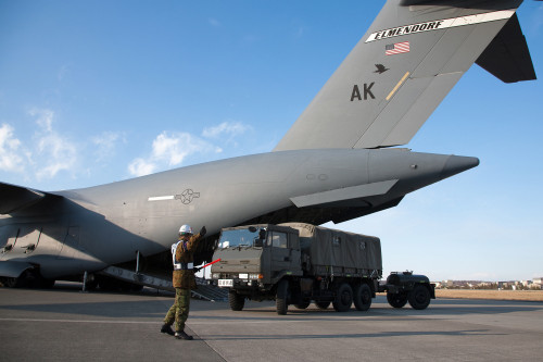 A Japanese soldier marshals vehicles from a C-17 Globemaster III Poster Print - Item # VARPSTSTK104200M