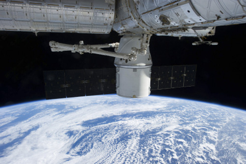 March 3, 2013 - The docking of SpaceX Dragon to the International Space Station above a cloud covered Earth Poster Print - Item # VARPSTSTK204600S