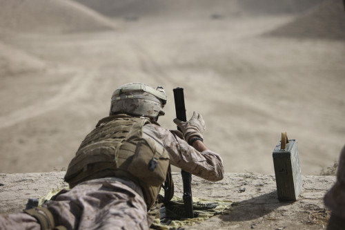 U.S. Marine clears a PK 7.62mm general-purpose machine gun after firing it at old russian APCs in a wadi near Kunduz, Afghanistan Poster Print - Item # VARPSTTMO100360M U.S. Marine clears a PK 7.62mm general-purpose machine gun after firing it at old russian APCs in a wadi near Kunduz, Afghanistan Poster Print - Item # VARPSTTMO100360M