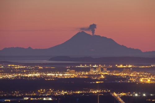 View Of Minor Eruption Of Ash And Steam From Mt. Redoubt With Anchorage, Alaska In The Foreground During Winter PosterPrint - Item # VARDPI2141347