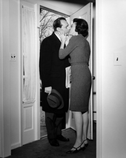 Couple kissing in doorway Poster Print - Item # VARSAL25528144