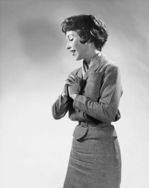 Side profile of a young woman standing with her hands clasped Poster Print - Item # VARSAL25541813
