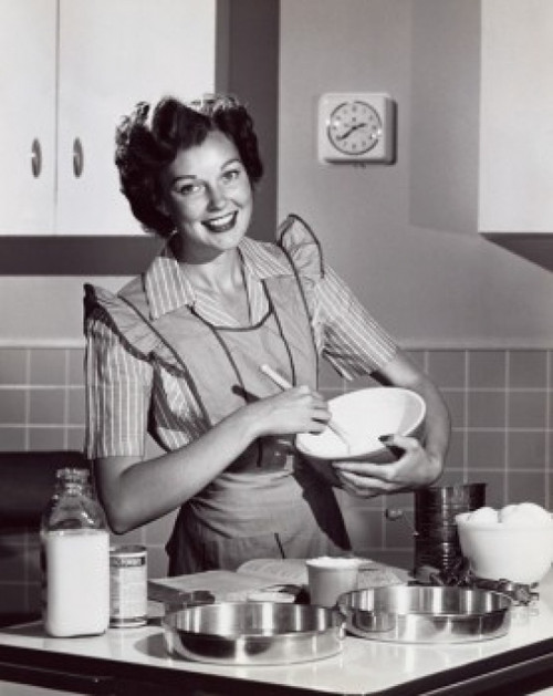 Portrait of a mid adult woman preparing food Poster Print - Item # VARSAL2552855