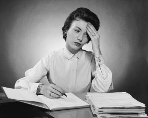 Businesswoman writing in a notebook in an office Poster Print - Item # VARSAL2557370