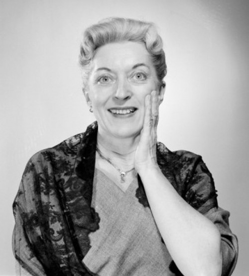 Surprised woman looking at camera and smiling Poster Print - Item # VARSAL255416555