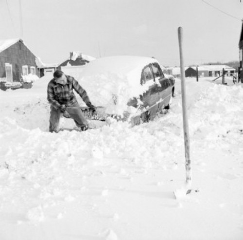 Man shoveling snow from car Poster Print - Item # VARSAL255424567